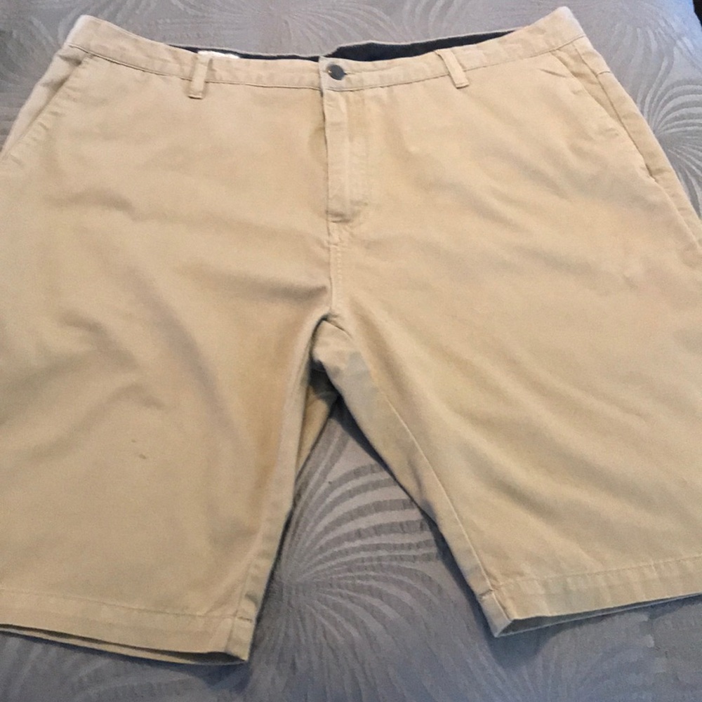 Tan volcom shorts- small light mark on left leg